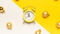 New year clock 2022. Retro style yellow clock in happy Christmas midnight. Countdown to happy xmas on yellow background Royalty Free Stock Photo