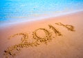 New Year 2018 coming concept. Digits on sand beach Royalty Free Stock Photo