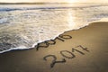New Year 2017 is coming concept. Happy New Year 2017 replace 2016 on the sea beach Royalty Free Stock Photo