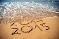 New Year 2015 is coming concept - inscription 2014 and 2015 on a beach sand Royalty Free Stock Photo