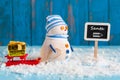 New Year is coming concept. Snowman with red sled Royalty Free Stock Photo