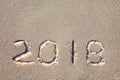 2018 laid out by seashells on the seashore