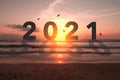 New year 2021 is coming with sunset beach background. New start for planing or set new resolution in life Royalty Free Stock Photo