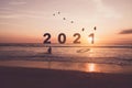 New year 2021 is coming with sunset beach background. New start for planing or set new resolution in life Royalty Free Stock Photo