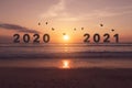 New year 2021 is coming with sunset beach background. New start for planing or set new resolution in life Royalty Free Stock Photo