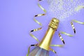 New Year composition champagne bottle with star spangles and ribbons.