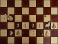 Concept photography, new year composition on a chessboard with a queen and other pieces, 2021, Flat lay, copy space Royalty Free Stock Photo