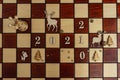 Concept photography, new year composition on a chessboard with a queen and other pieces, 2021, Flat lay, copy space Royalty Free Stock Photo