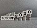 new year concept. Budget 2020 text on wooden blocks with stack of coins background Royalty Free Stock Photo