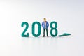 2018 New year concept business man miniature figures standing on Royalty Free Stock Photo