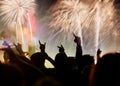 new Year concept - cheering crowd and fireworks