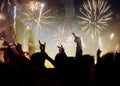 new Year concept - cheering crowd and fireworks