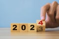 New year concept.Hand flipping of wooden cube block change from 2023 to 2024.,new life, new business, plan, goals, strategy Royalty Free Stock Photo