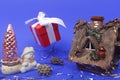 New year concept. Hut, snowman, Christmas tree and a gift on a blue background Royalty Free Stock Photo