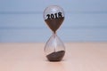 New Year 2019 concept. Time running out concept with hourglass falling sand Royalty Free Stock Photo