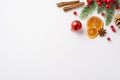 New Year concept. Top view photo of red bauble pine cone dried orange slices cinnamon sticks anise mistletoe berries and spruce