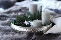 New Year concept: tray with decorative spruce branches, candles and Christmas lights Royalty Free Stock Photo