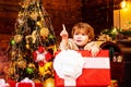 New year concept. Winter kid. Christmas children. Child with big gift box. Winter Christmas emotion. Child with a Royalty Free Stock Photo