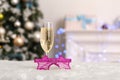 New Year. Decorated room no people glass of champagne and fancy glasses close-up blurred background Royalty Free Stock Photo