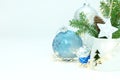 New year decorations with green christmas tree branch, glass balls and glowing garland lights Royalty Free Stock Photo