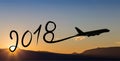 New year 2018 drawing by airplane on the air at sunrise Royalty Free Stock Photo
