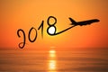New year 2018 drawing by airplane on the air at sunrise Royalty Free Stock Photo