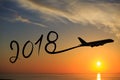 New year 2018 drawing by airplane on the air at sunrise Royalty Free Stock Photo