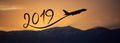 New year 2019 by flying airplane on the air at sunrise, banner