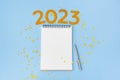 New Year empty goals, plans 2023 concept with notebook and pen. flat lay style. Christmas planning concept