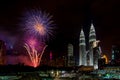 New Year Eve celebration with fireworks display at Golden Triangle Kuala Lumpur with twin tower & KL tower background. Royalty Free Stock Photo