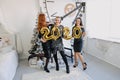 New Year Eve party. Celebrating of New Year. Three beautiful young girls with golden baloons 2020 celebrating new year. Young