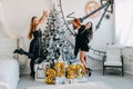 New Year Eve 2020 party. Celebrating of New Year. Three Happy Young girls with golden baloons 2020 celebrating new year. Young