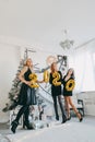 New Year Eve 2020 party. Celebrating of New Year. Three Happy Young girls with golden baloons 2020 celebrating new year. Young