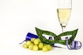 New Year Eve party favors next to glass of Champagne and grapes Royalty Free Stock Photo