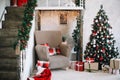 New Year festive interior. Holiday concept. Decorated Christmas tree with gifts. Decorated Christmas porch. Royalty Free Stock Photo