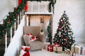 New Year festive interior. Holiday concept. Decorated Christmas tree with gifts. Decorated Christmas porch. Royalty Free Stock Photo