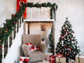 New Year festive interior. Holiday concept. Decorated Christmas tree with gifts. Decorated Christmas porch. Royalty Free Stock Photo