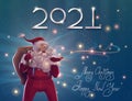 2021 New Year figures with Merry Christmas and Happy New Year text for holiday greeting card with lights over blue background Royalty Free Stock Photo