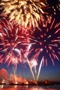 New year fireworks above water with reflection on the black sky Royalty Free Stock Photo