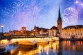 new year fireworks over Zurich city center with famous Fraumunster and Grossmunster Churches and river Limmat at Lake Zurich,