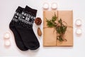 New year 2021 flat lay. Black ornamental socks, gift box in eco kraft paper with pine tree cones. Zero waste Christmas Royalty Free Stock Photo