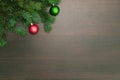 New year flat layout. Christmas balls and pine tree on wooden background Royalty Free Stock Photo