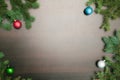 New year flat layout. Christmas balls and pine tree on wooden background Royalty Free Stock Photo