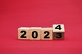 New year 2024, flipping wooden block from 2023, new life beginning preparation