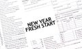 NEW YEAR FRESH START words on paper sheet with documents Royalty Free Stock Photo
