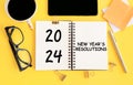 2024 new year goal, plan, action. Concepts with text on notepad and office accessories. Business management, Inspiration to Royalty Free Stock Photo