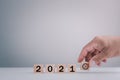 New year 2021 and goal target plan, Hand holding wood cubes with New year 2021 and goal or target icon. concept of New year Busine Royalty Free Stock Photo