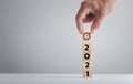 New year 2021 and goal target plan, Hand holding wood cubes with New year 2021 and goal or target icon. concept of New year Busine Royalty Free Stock Photo