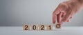 New year 2021 and goal target plan, Hand holding wood cubes with New year 2021 and goal or target icon. concept of New year Busine Royalty Free Stock Photo