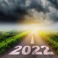 New Year 2022 Goals Concept : Empty asphalt road clouds  and sunset with text go to New year 2022 Royalty Free Stock Photo